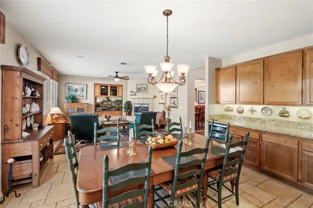 a large kitchen with a table and chairs