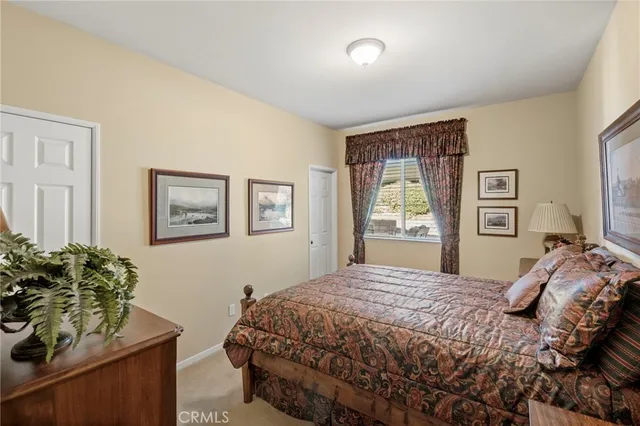 a bathroom with a sink and mirror with toilet