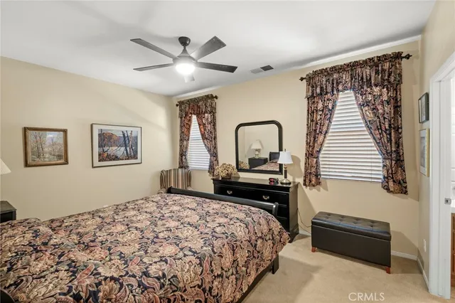 a kitchen with a refrigerator a sink and cabinets
