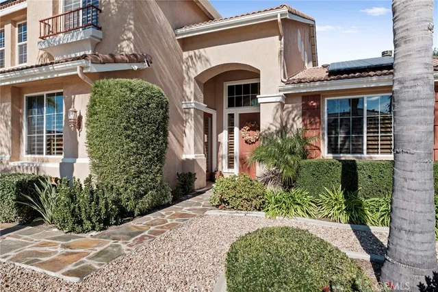 a front view of a house with a large window