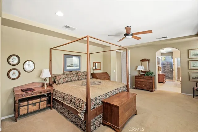 a spacious bathroom with a tub and a large window