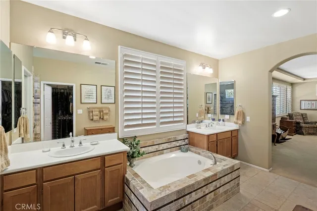 a bedroom with two beds and a window