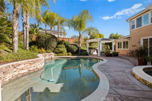 a view of a porch with furniture and garden
