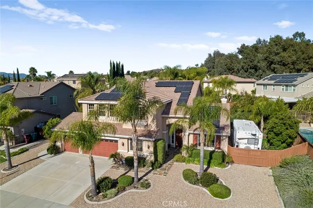 an aerial view of a house with a garden
