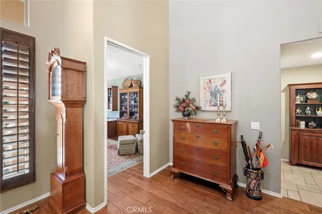 a living room with furniture a window and bookshelf