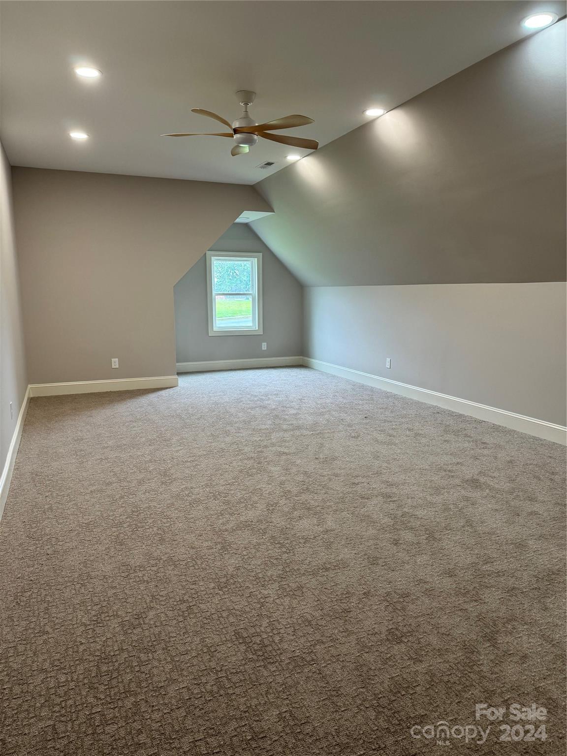 4305 Holly Circle Northeast Conover, NC 28613 - Photo 11 of 36 en empty room with windows and fan