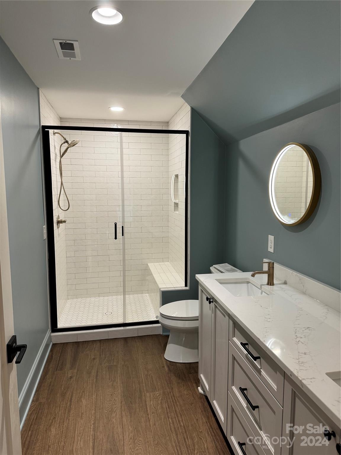 4305 Holly Circle Northeast Conover, NC 28613 - Photo 12 of 36 a bathroom with a double vanity sink toilet and shower