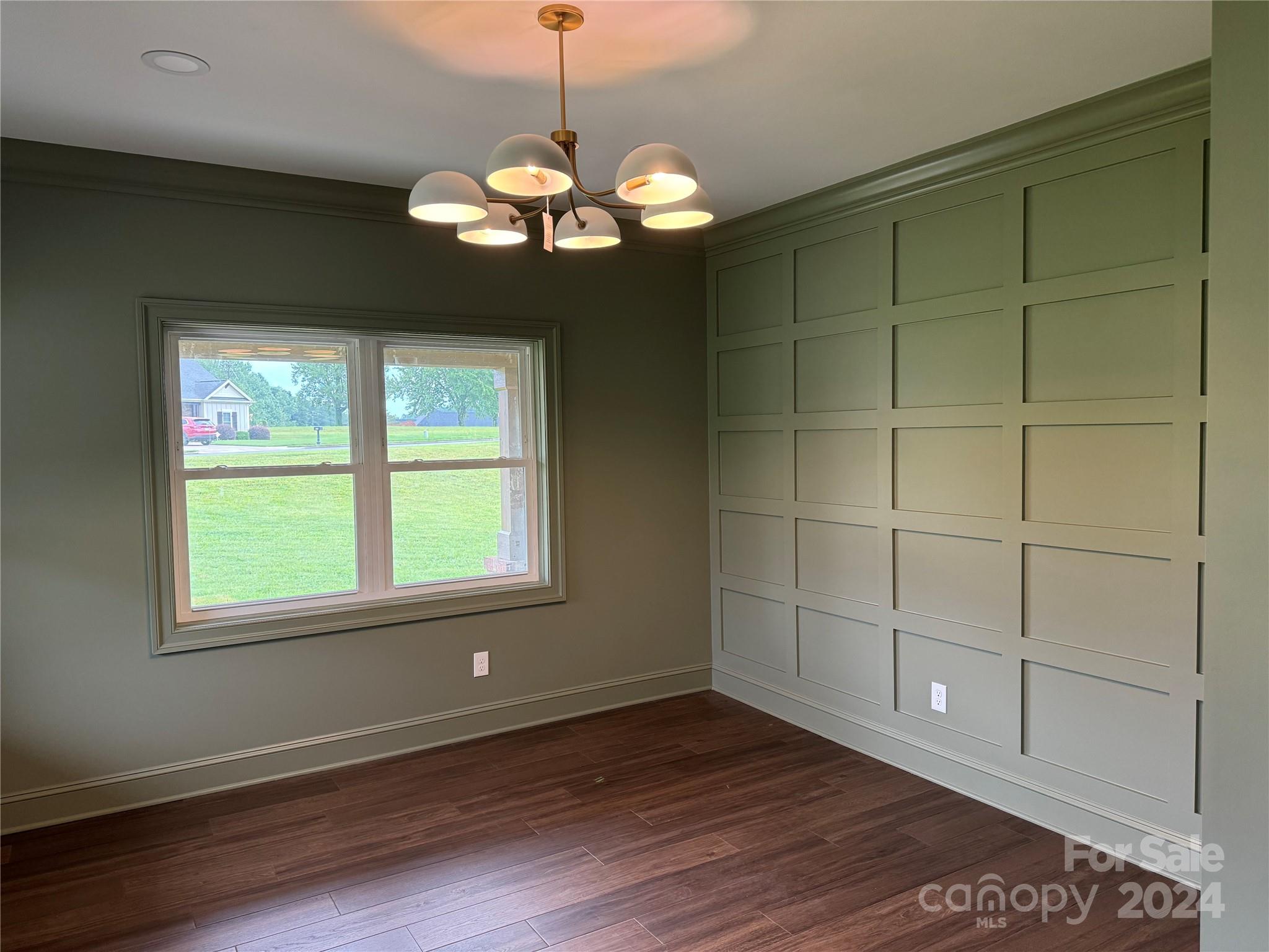 4305 Holly Circle Northeast Conover, NC 28613 - Photo 24 of 36 a view of an empty room with a window and wooden floor
