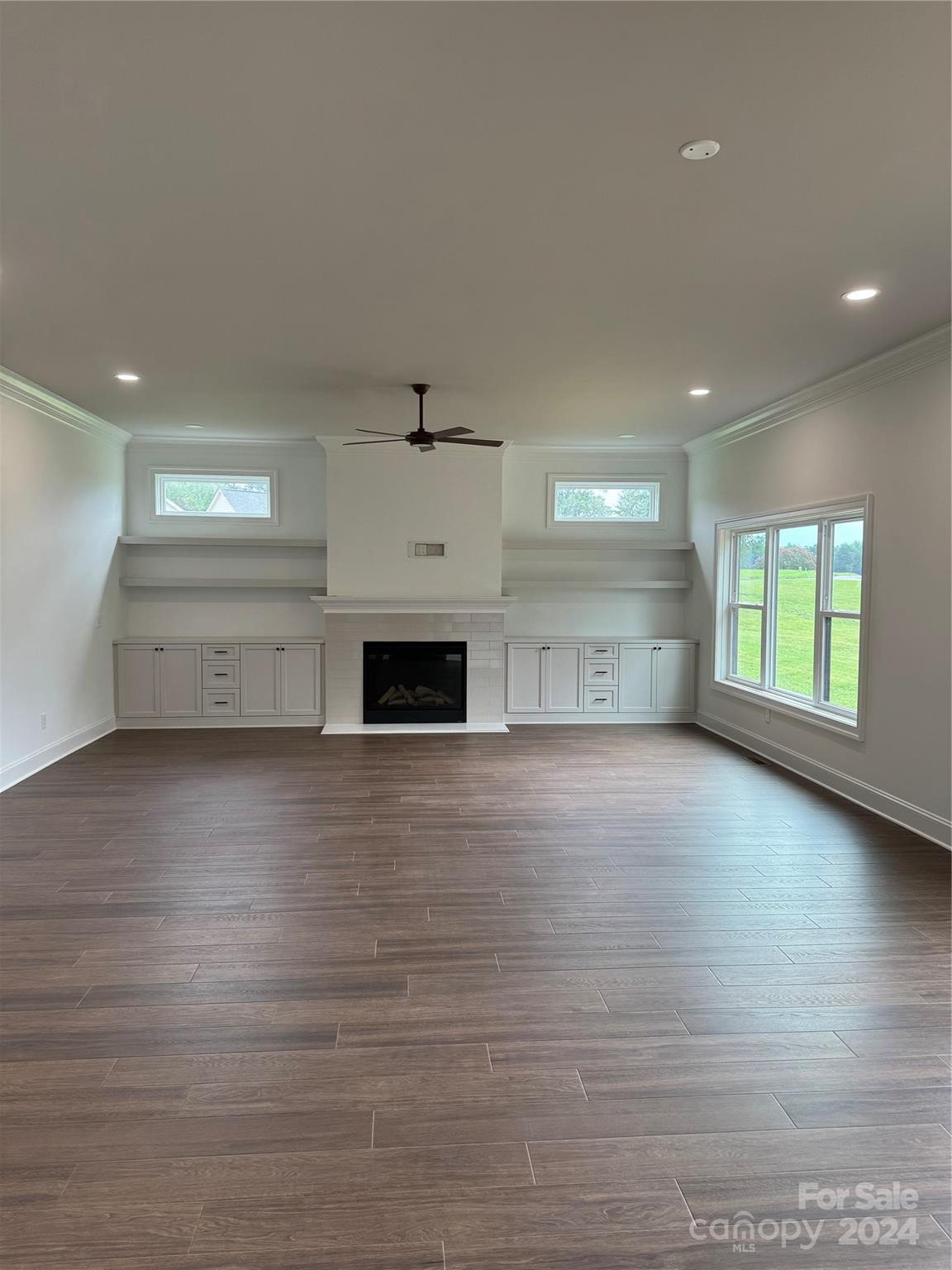 4305 Holly Circle Northeast Conover, NC 28613 - Photo 26 of 36 a view of empty room with kitchen and window