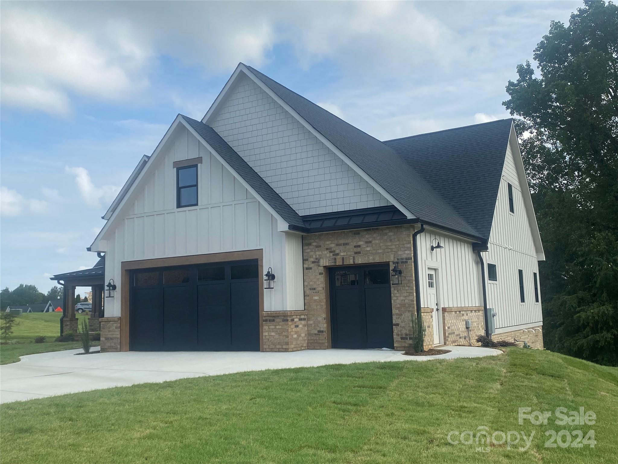 4305 Holly Circle Northeast Conover, NC 28613 - Photo 31 of 36 a front view of a house with a yard and a garage