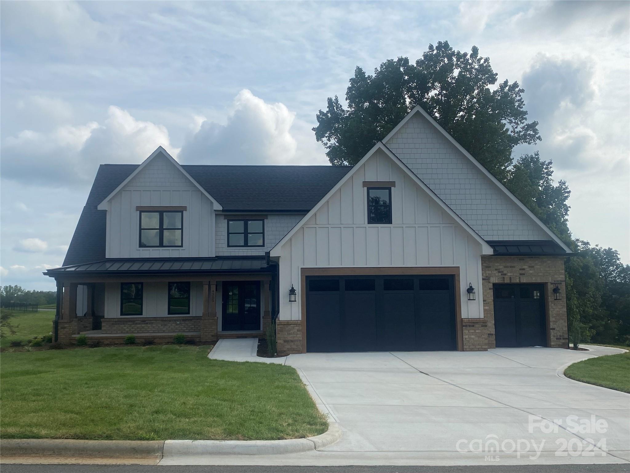 4305 Holly Circle Northeast Conover, NC 28613 - Photo 33 of 36 a front view of a house with a garden