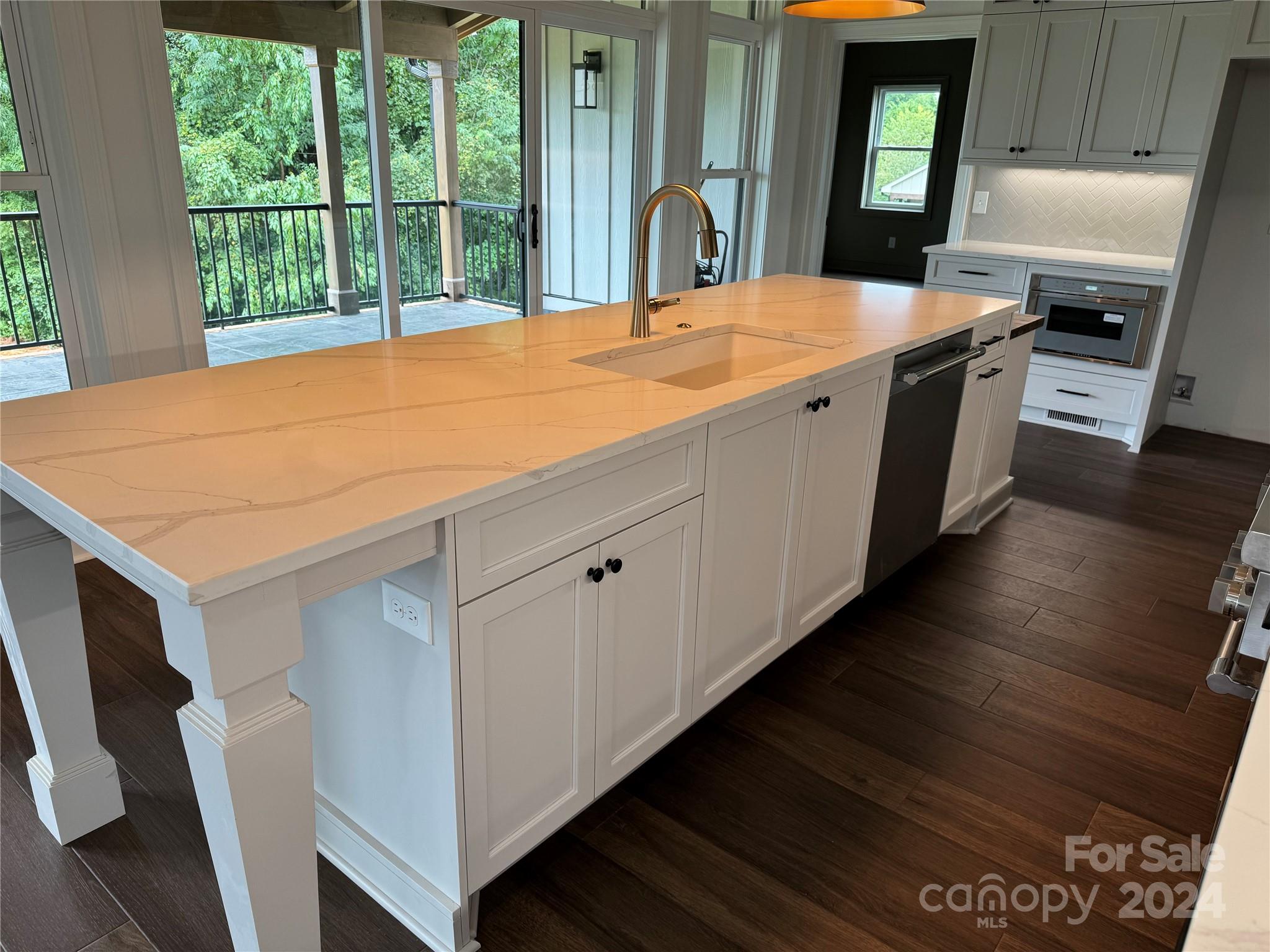 4305 Holly Circle Northeast Conover, NC 28613 - Photo 7 of 36 a open kitchen with stainless steel appliances granite countertop a sink and a stove