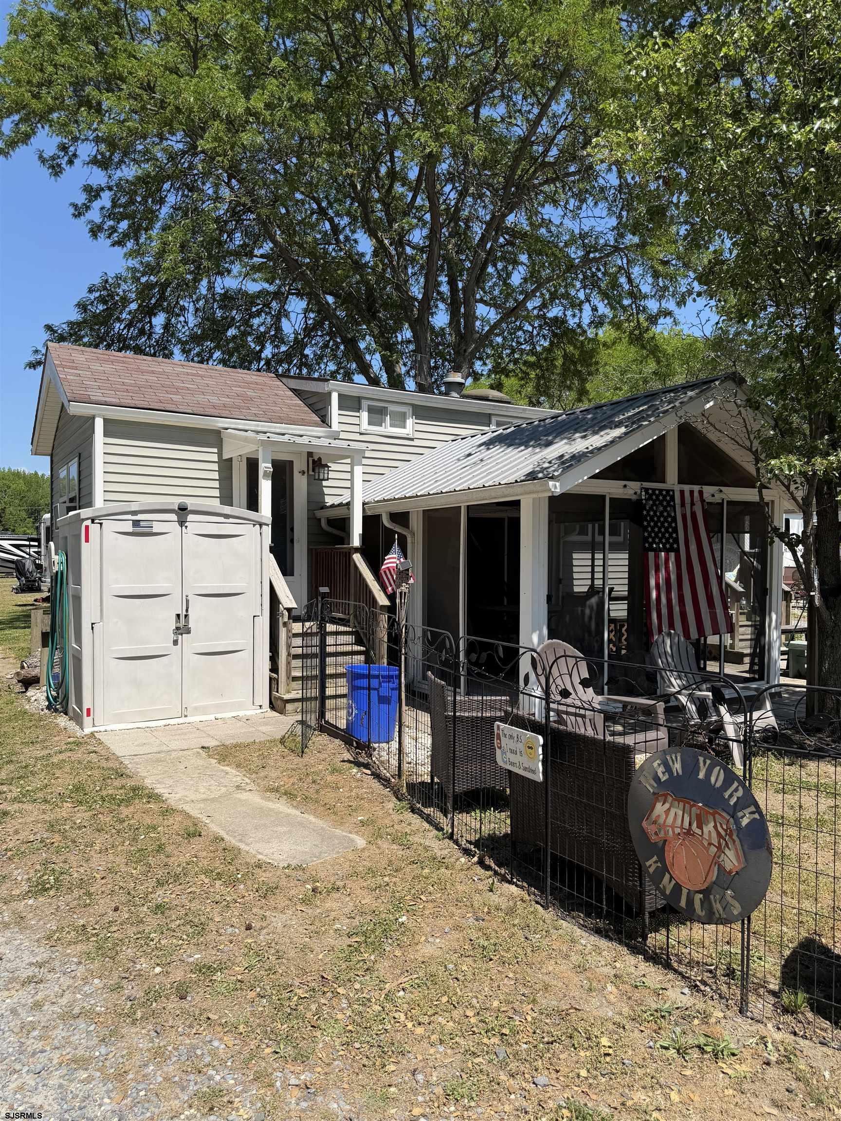 631 Chestnut Neck Road Port Republic, NJ 08241 - Photo 11 of 13 a view of a house with a patio and backyard