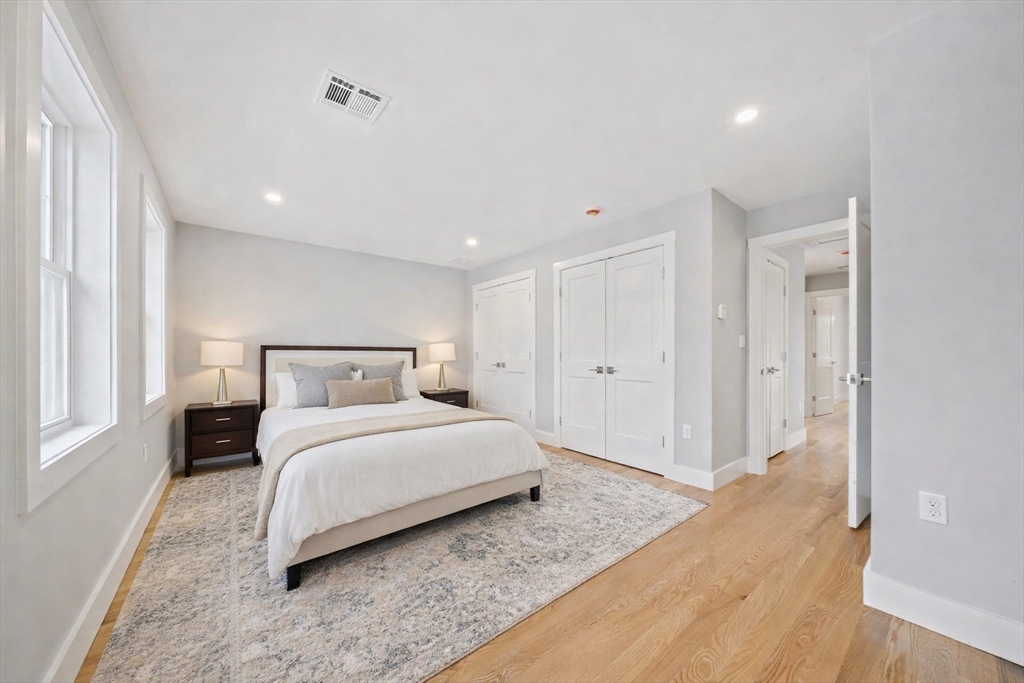 77 Neponset Street, Unit 77 Canton, MA 02021 - Photo 15 of 25 a bedroom with a bed and a window