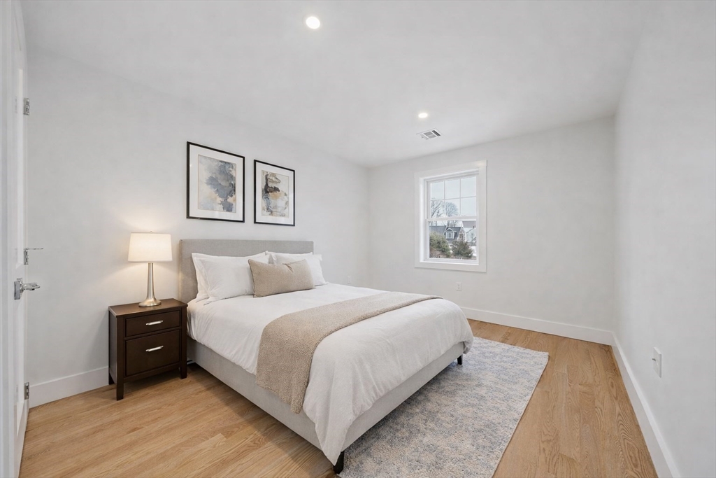 77 Neponset Street, Unit 77 Canton, MA 02021 - Photo 19 of 28 a bedroom with a bed and a window