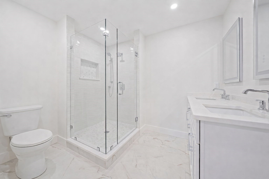 77 Neponset Street, Unit 77 Canton, MA 02021 - Photo 23 of 28 a bathroom with a shower a toilet and sink