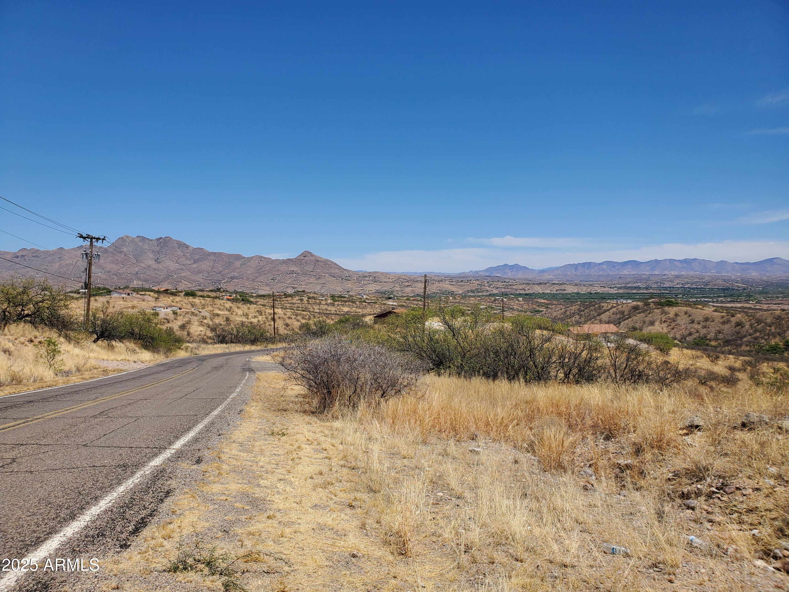 501 Camino Ramanote, Unit 19 Rio Rico, AZ 85648 - Photo 13 of 14 a view of lake and mountain