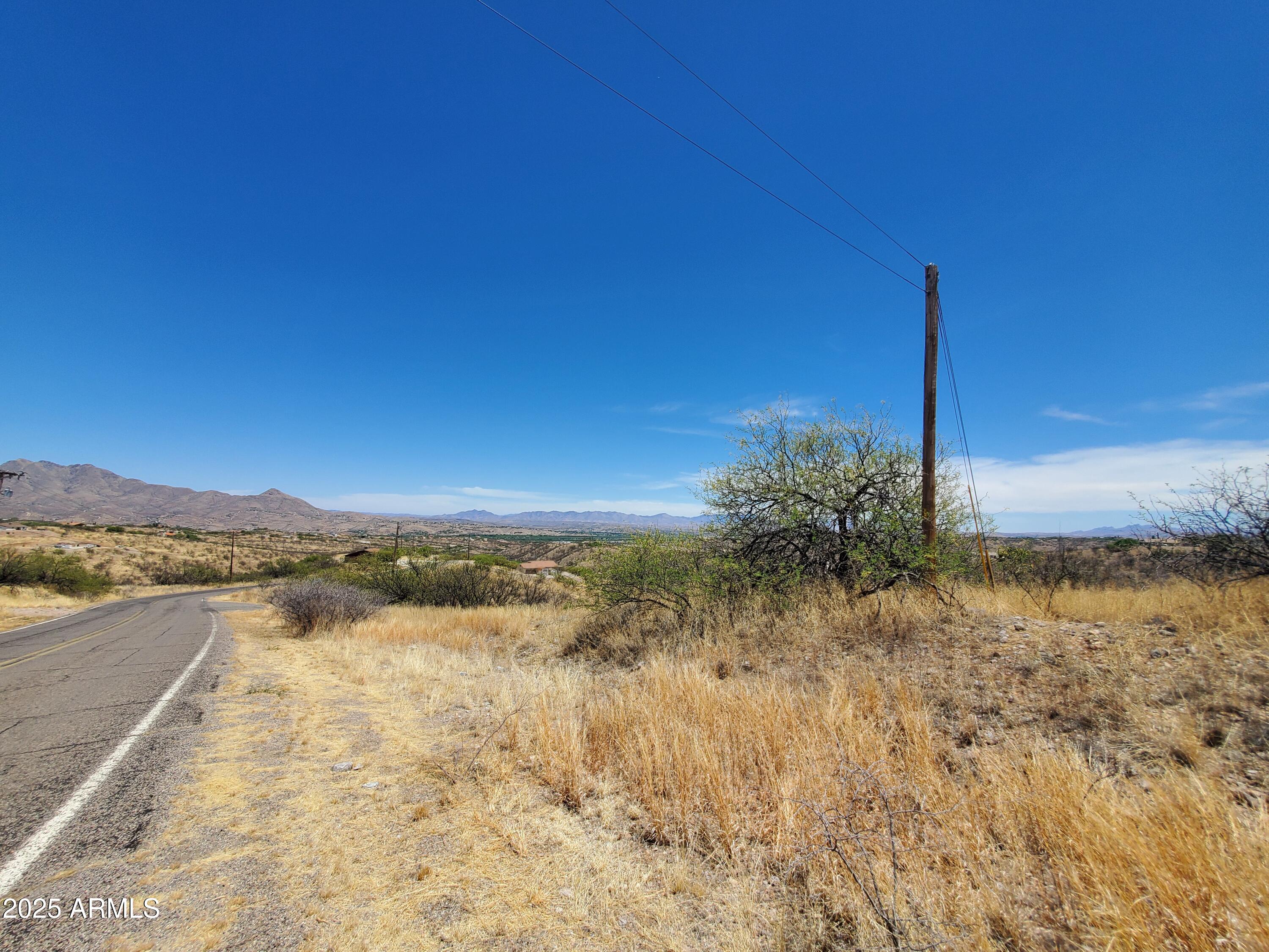 501 Camino Ramanote, Unit 19 Rio Rico, AZ 85648 - Photo 14 of 14 a view of a lake with a mountain in the background