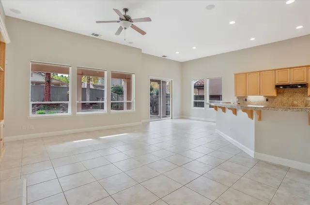 a bedroom with bed and a potted plant