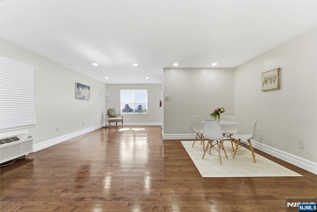 144 70th Street, Unit 1E Guttenberg, NJ 07093 - Photo 3 of 20 a view of a living room and dining room