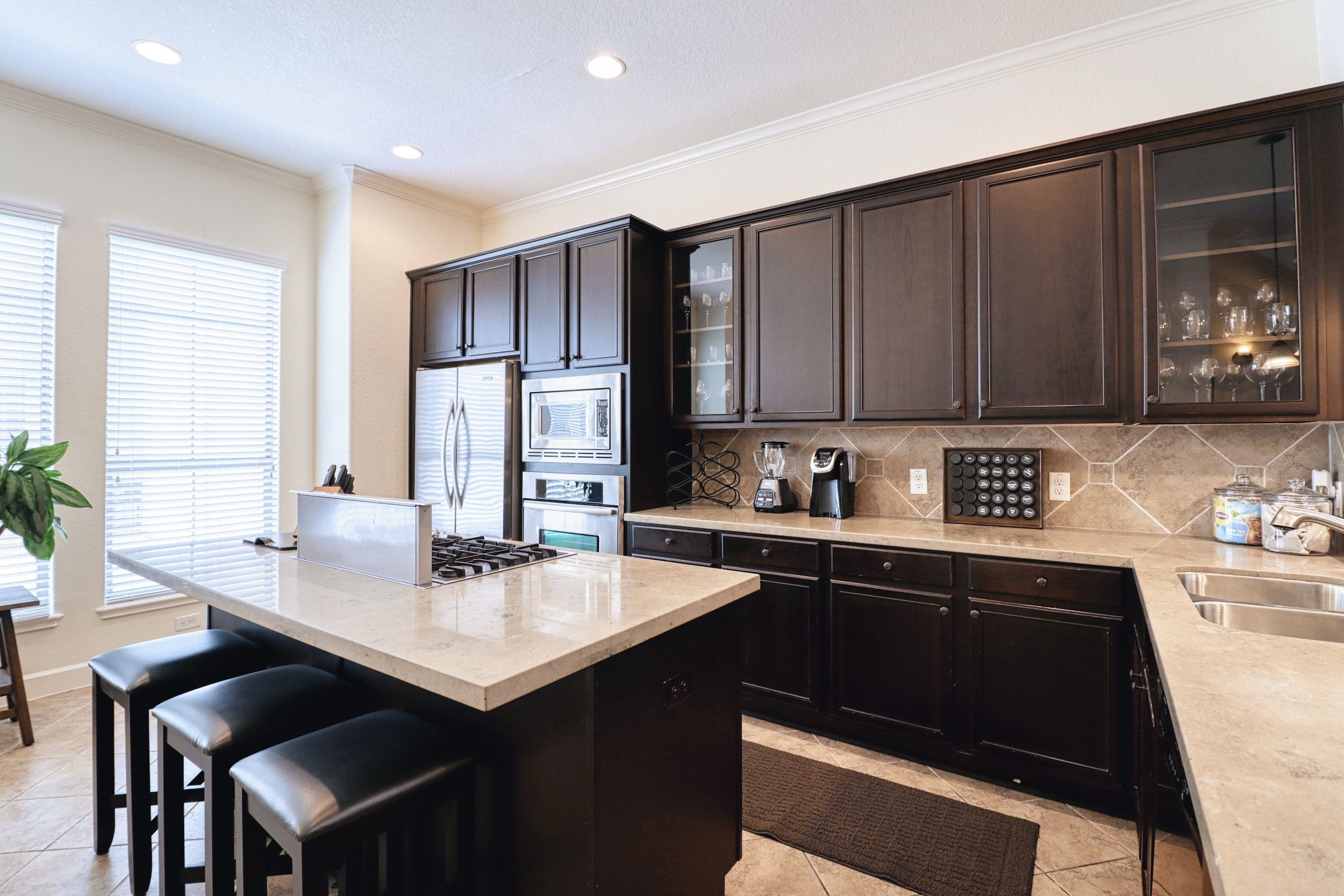 904 Patterson Street Houston, TX 77007 - Photo 15 of 30 a kitchen with a sink cabinets and window