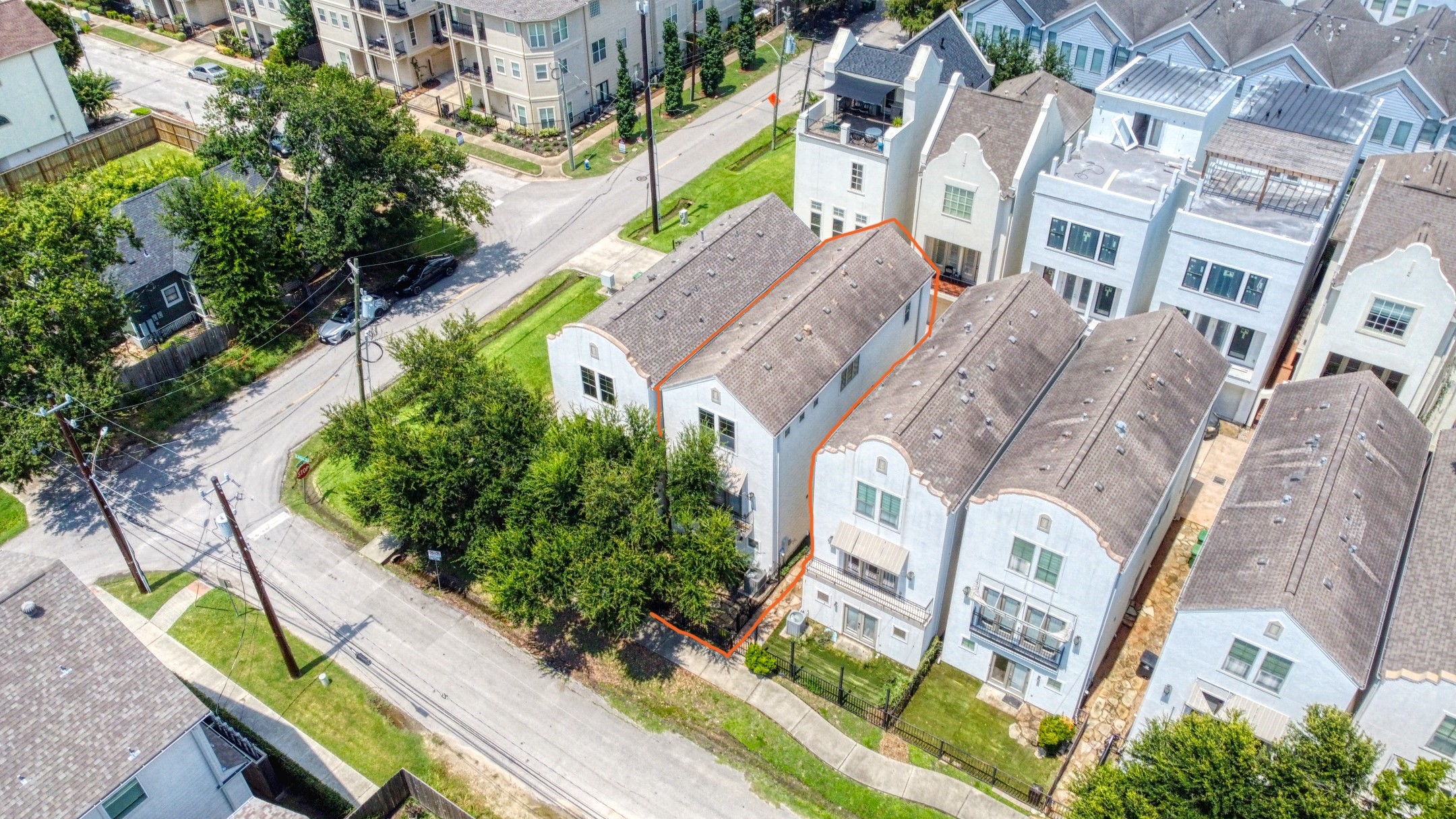 904 Patterson Street Houston, TX 77007 - Photo 3 of 30 an aerial view of a residential apartment building with a yard and potted plants