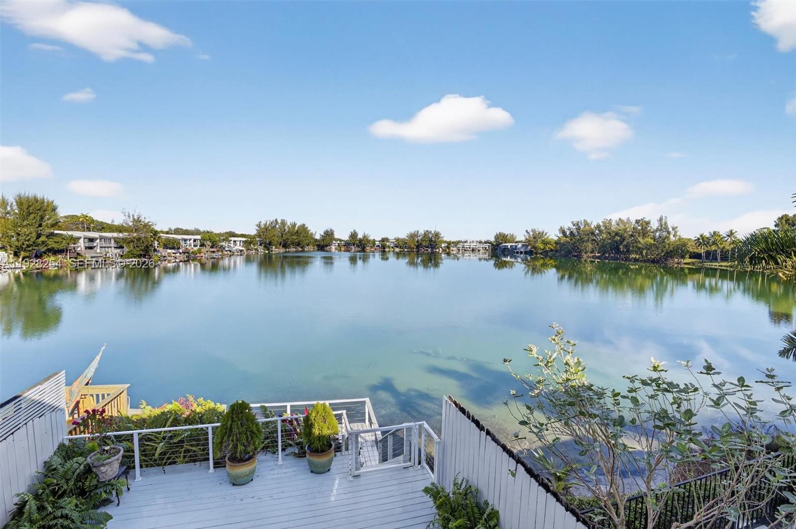 7043 Southwest 53rd Lane Miami, FL 33155 - Photo 25 of 41 a view of a lake with a table and chairs