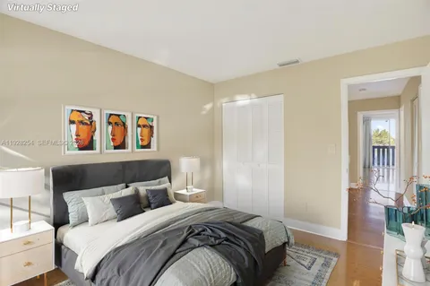 a bedroom with a bed and a lamp