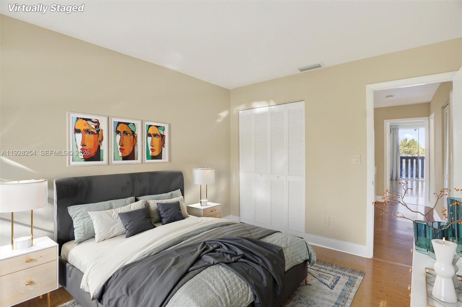 7043 Southwest 53rd Lane Miami, FL 33155 - Photo 26 of 41 a bedroom with a bed and a painting on the wall