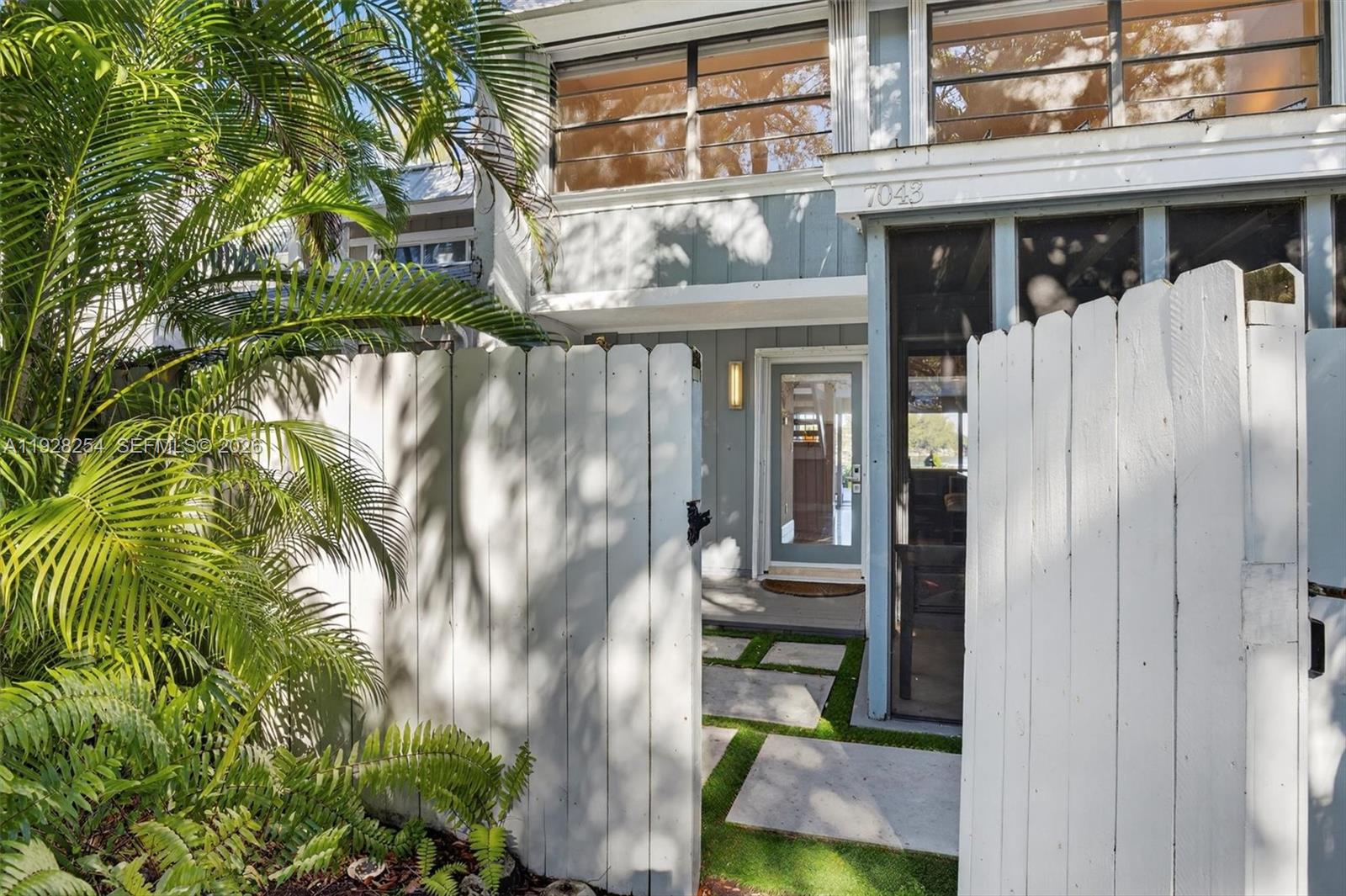 7043 Southwest 53rd Lane Miami, FL 33155 - Photo 3 of 41 a view of a house with a yard