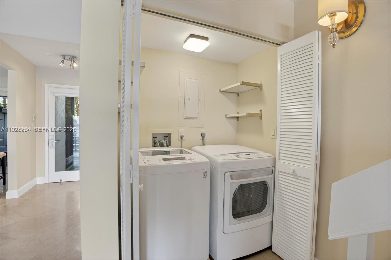 7043 Southwest 53rd Lane Miami, FL 33155 - Photo 31 of 41 a utility room with dryer and washer