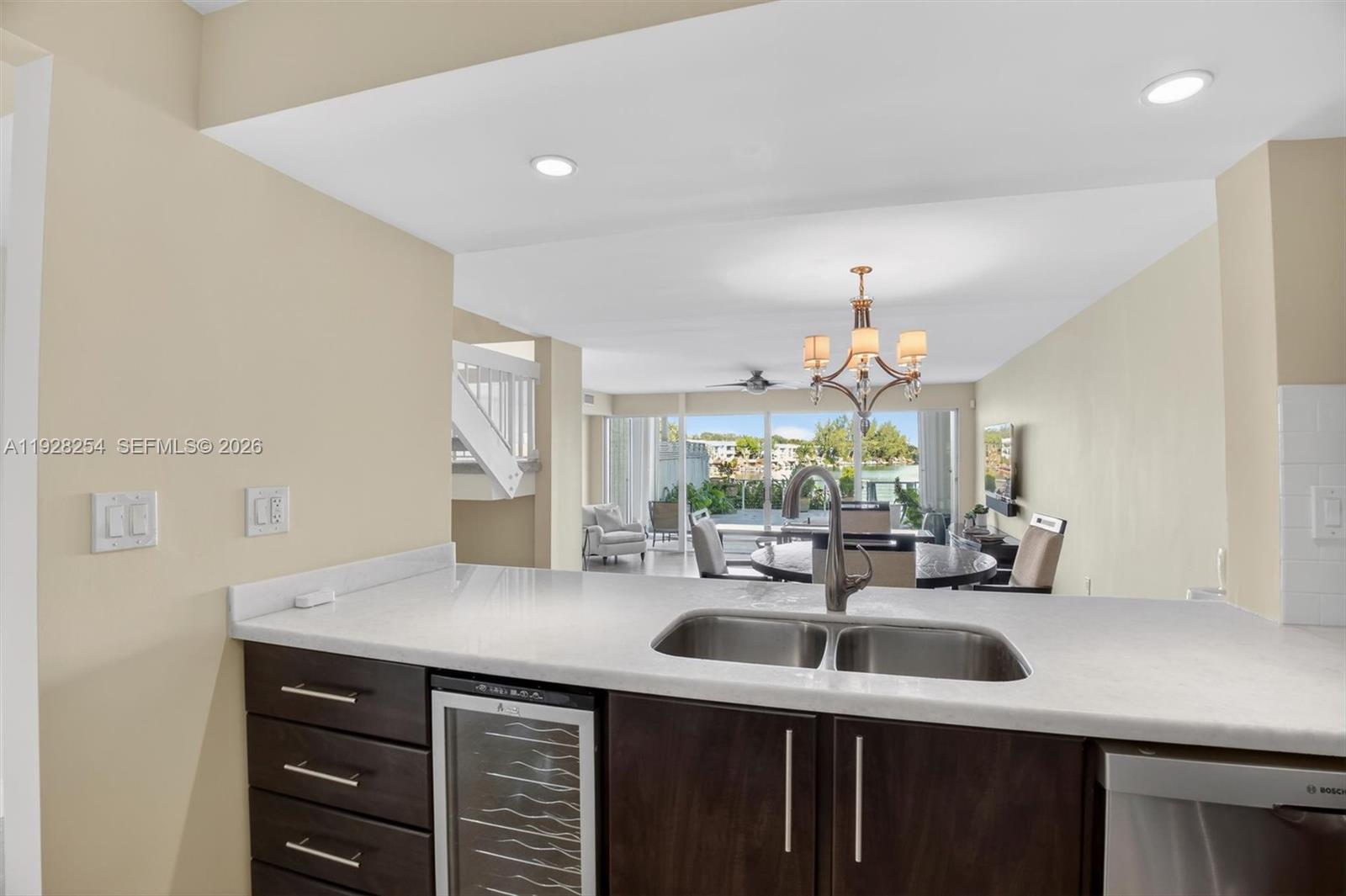 7043 Southwest 53rd Lane Miami, FL 33155 - Photo 6 of 41 a kitchen with counter top space sink and living room