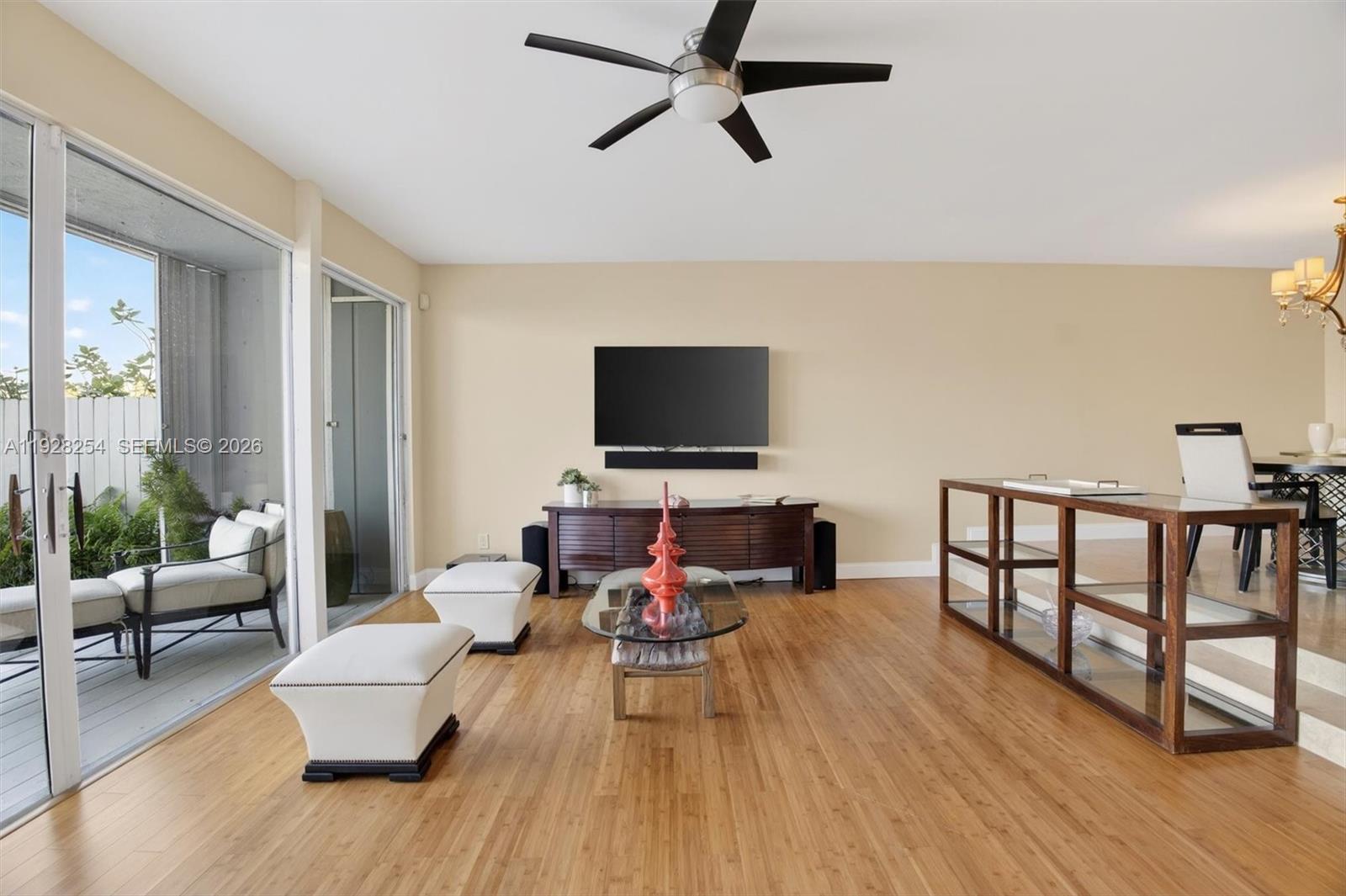 7043 Southwest 53rd Lane Miami, FL 33155 - Photo 10 of 41 a living room with furniture and a flat screen tv