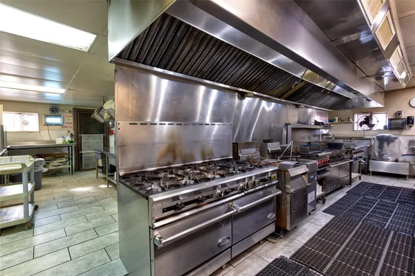 a kitchen with stainless steel appliances granite countertop lots of counter top space