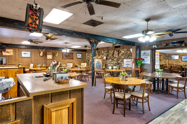 a kitchen with a table and chairs in it