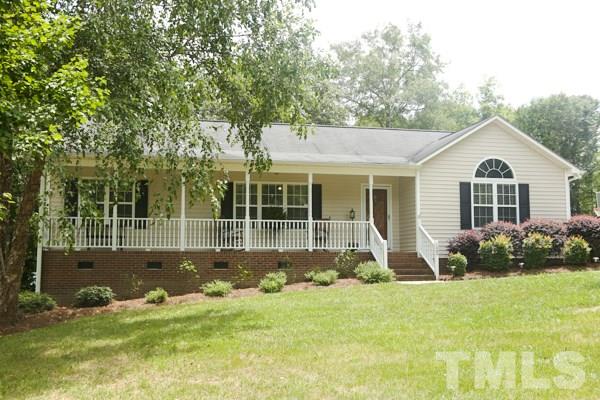 122 Forest Lane Garner, NC 27529 - Photo 1 of 18 a front view of a house with garden