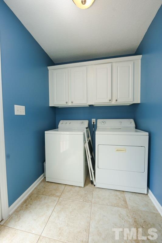 122 Forest Lane Garner, NC 27529 - Photo 14 of 18 a utility room with dryer and washer