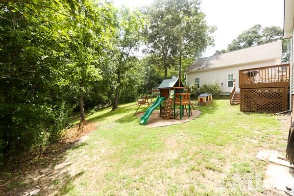 122 Forest Lane Garner, NC 27529 - Photo 17 of 18 a view of a house with backyard porch and sitting area