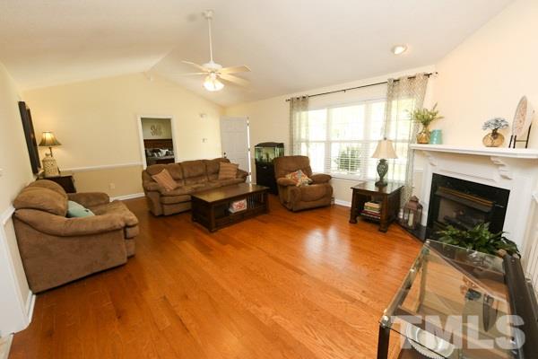 122 Forest Lane Garner, NC 27529 - Photo 3 of 18 a living room with furniture and a fireplace