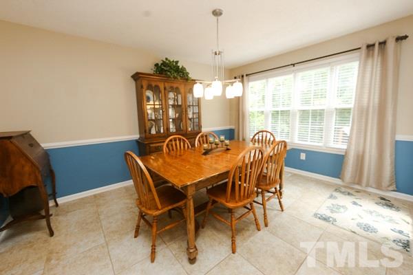 122 Forest Lane Garner, NC 27529 - Photo 4 of 18 a view of a dining room with furniture window and outside view