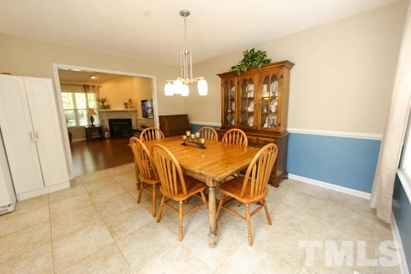 122 Forest Lane Garner, NC 27529 - Photo 5 of 18 a dining room with furniture and chandelier