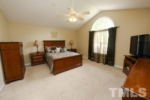 122 Forest Lane Garner, NC 27529 - Photo 8 of 18 a bedroom with furniture and window