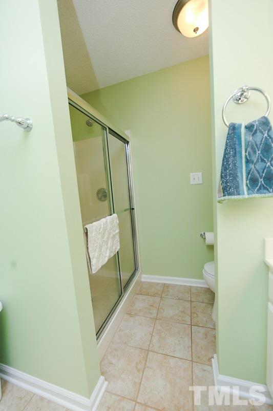 122 Forest Lane Garner, NC 27529 - Photo 10 of 18 a bathroom with a granite countertop shower and a sink