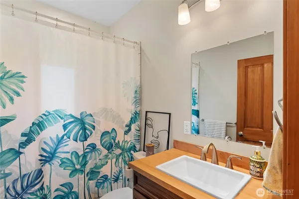 a room with furniture and a potted plant