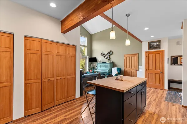 a kitchen with a sink appliances and cabinets