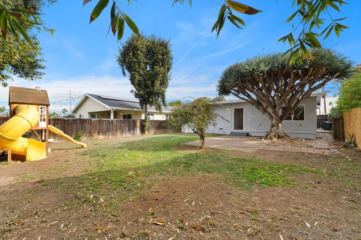180 5th Avenue Chula Vista, CA 91910 - Photo 12 of 18 a view of a house with backyard and a tree