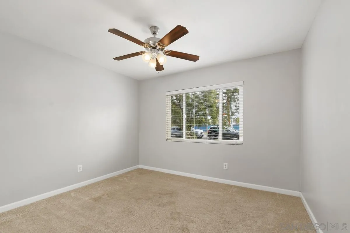 180 5th Avenue Chula Vista, CA 91910 - Photo 17 of 18 an empty room with a window and a fan