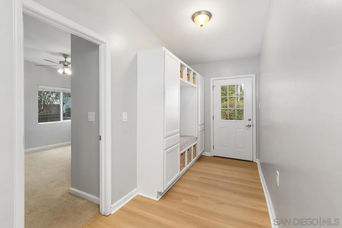 180 5th Avenue Chula Vista, CA 91910 - Photo 9 of 18 a view of a hallway with wooden floor and closet