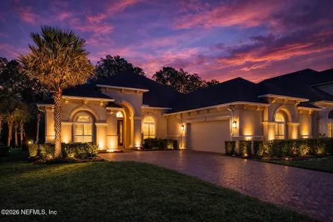 a view of a big house with a big yard