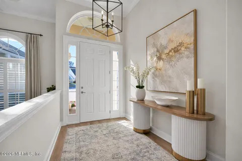 a view of hallway with chandelier